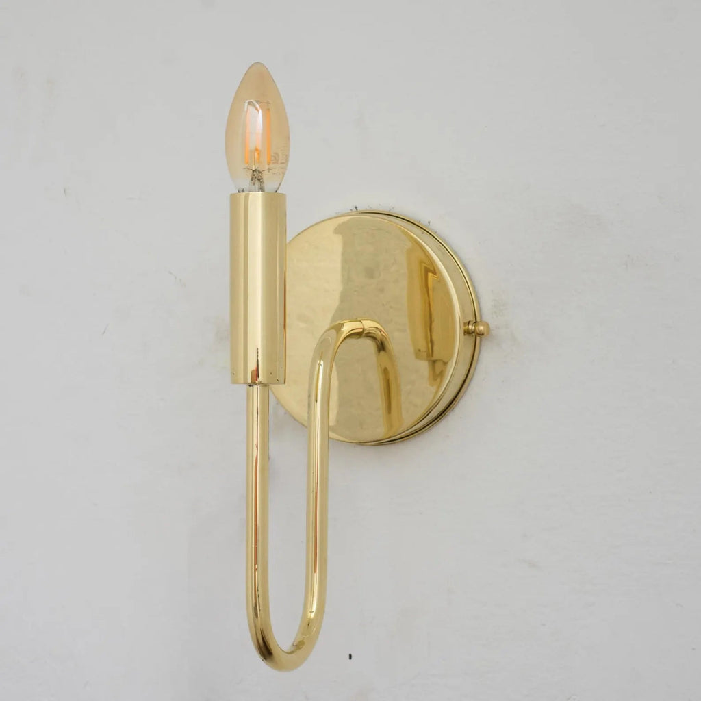 Unlacquered brass wall sconce shown without the optional linen shade