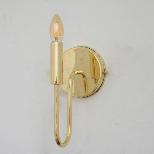Unlacquered brass wall sconce shown without the optional linen shade