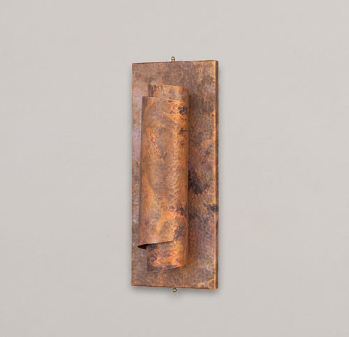 Full view of the antique hammered copper wall sconce with rectangular backplate