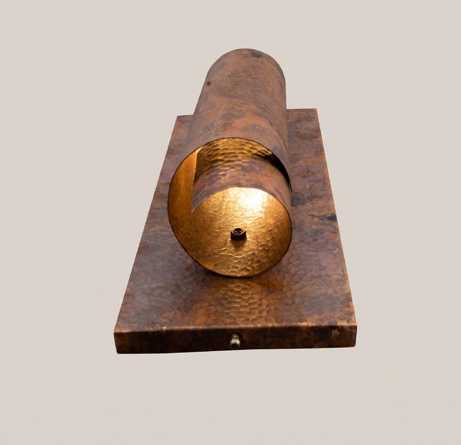 Underside view of the copper wall sconce and bulb opening