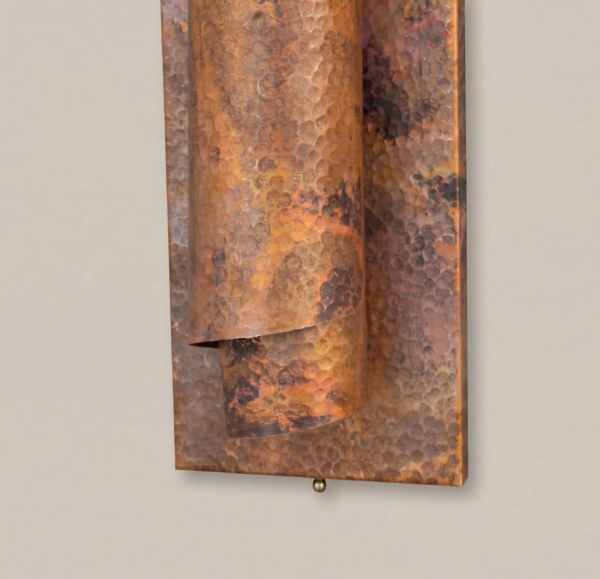 Close-up of the copper patina and hand-worked surface