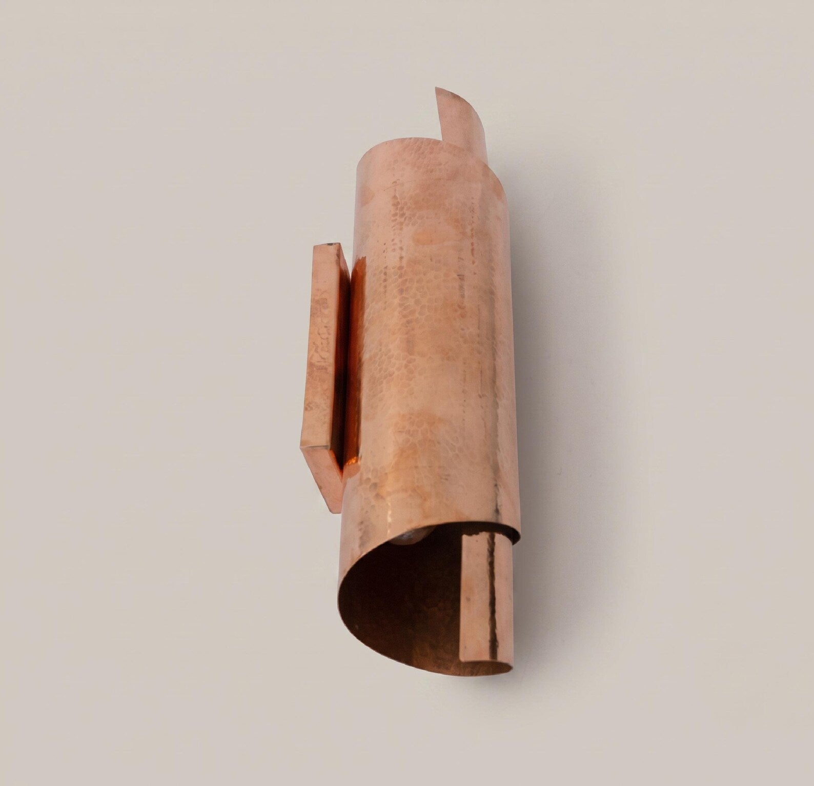 Side and underside view of the copper wall sconce and mounting plate