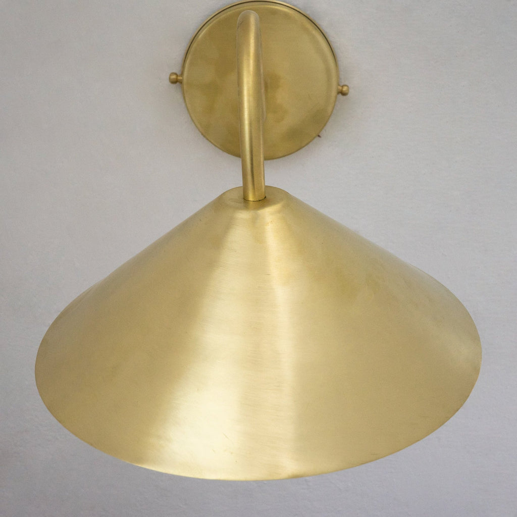 Close-up of the hand-brushed brass cone shade