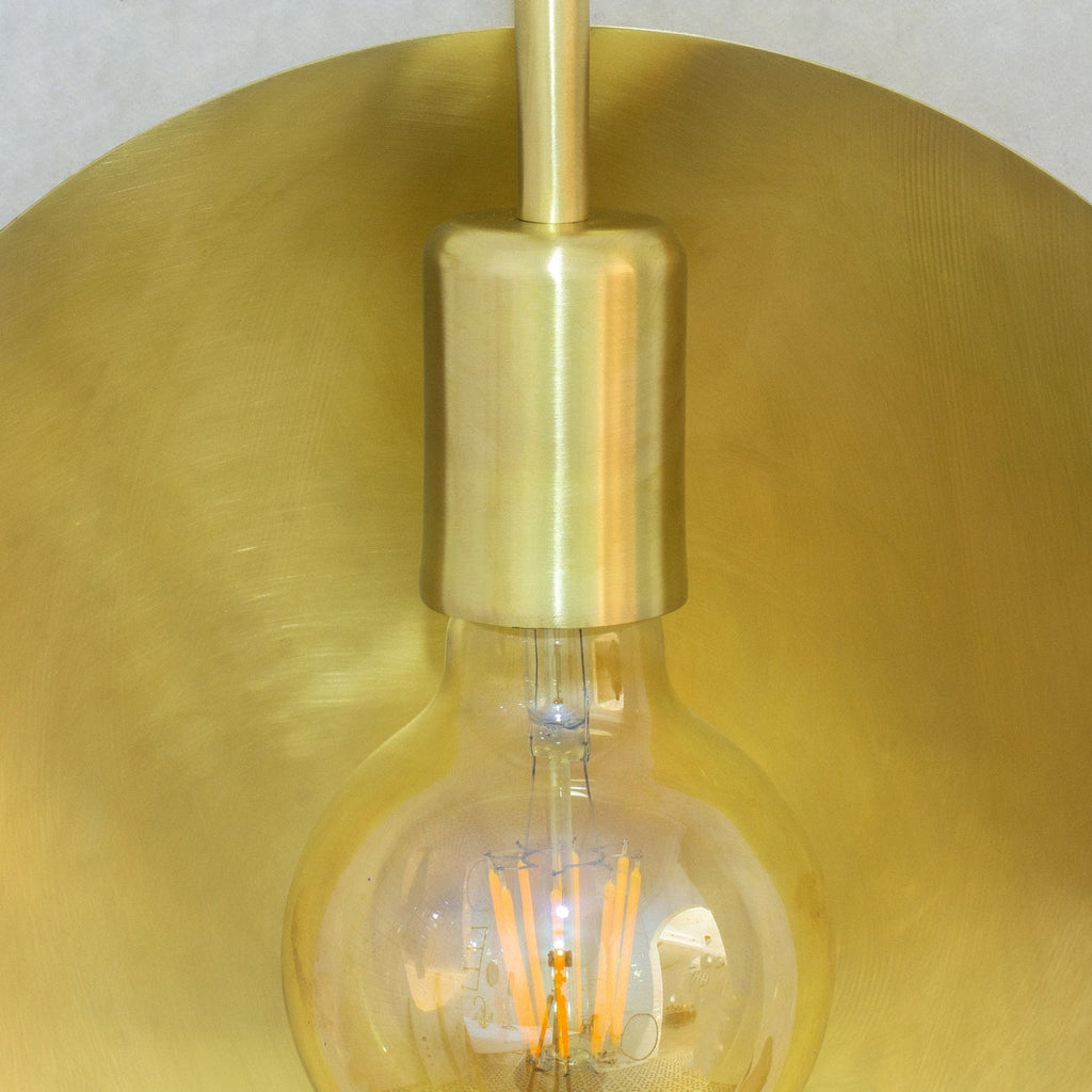 Close-up of the brushed brass reflector and socket fitting