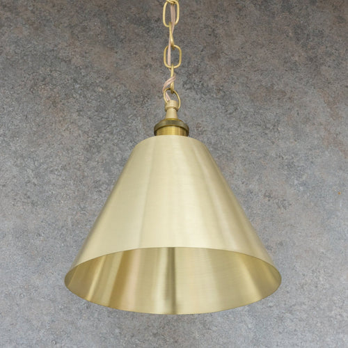 Full view of the satin brushed brass conical pendant shade