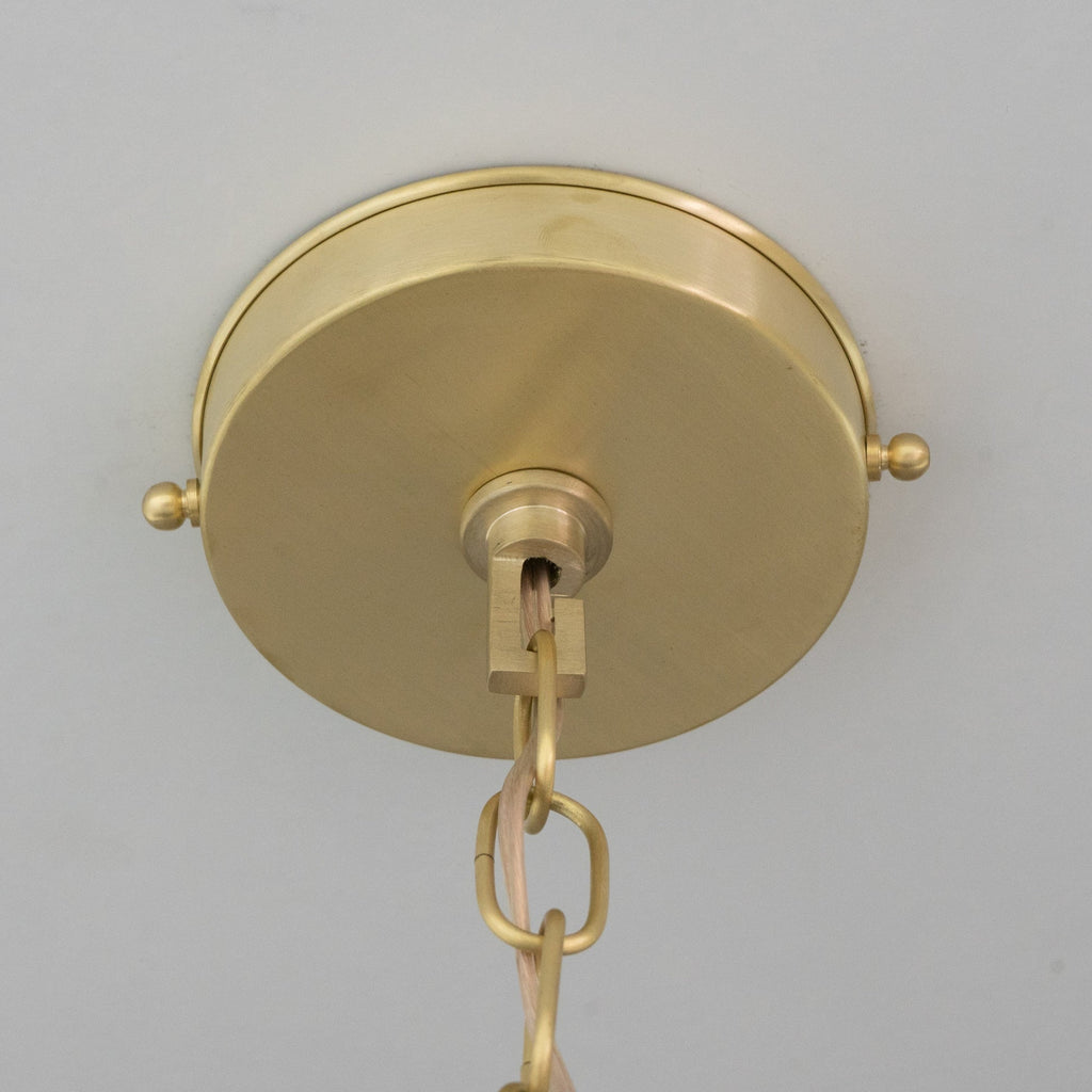Brass ceiling canopy and suspension connection viewed from below