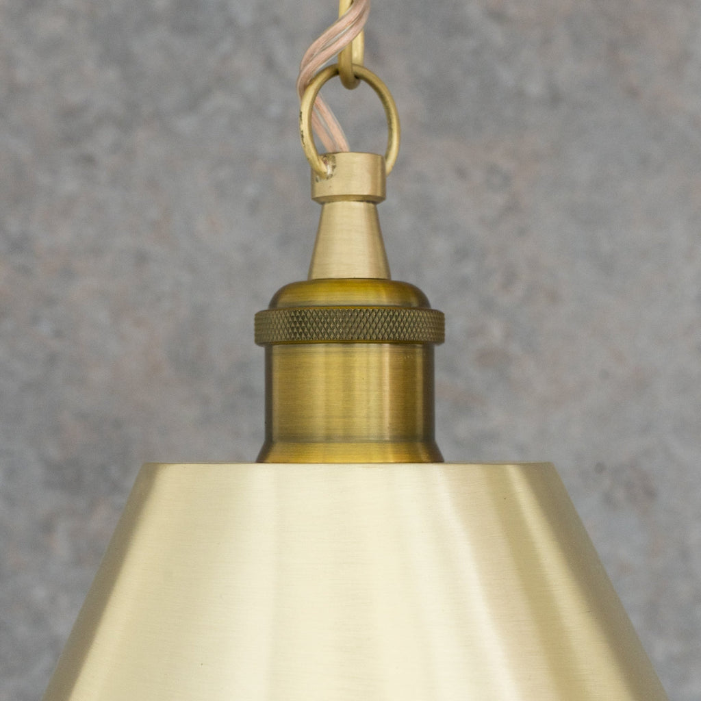 Close-up of the brass chain connection and pendant fitting