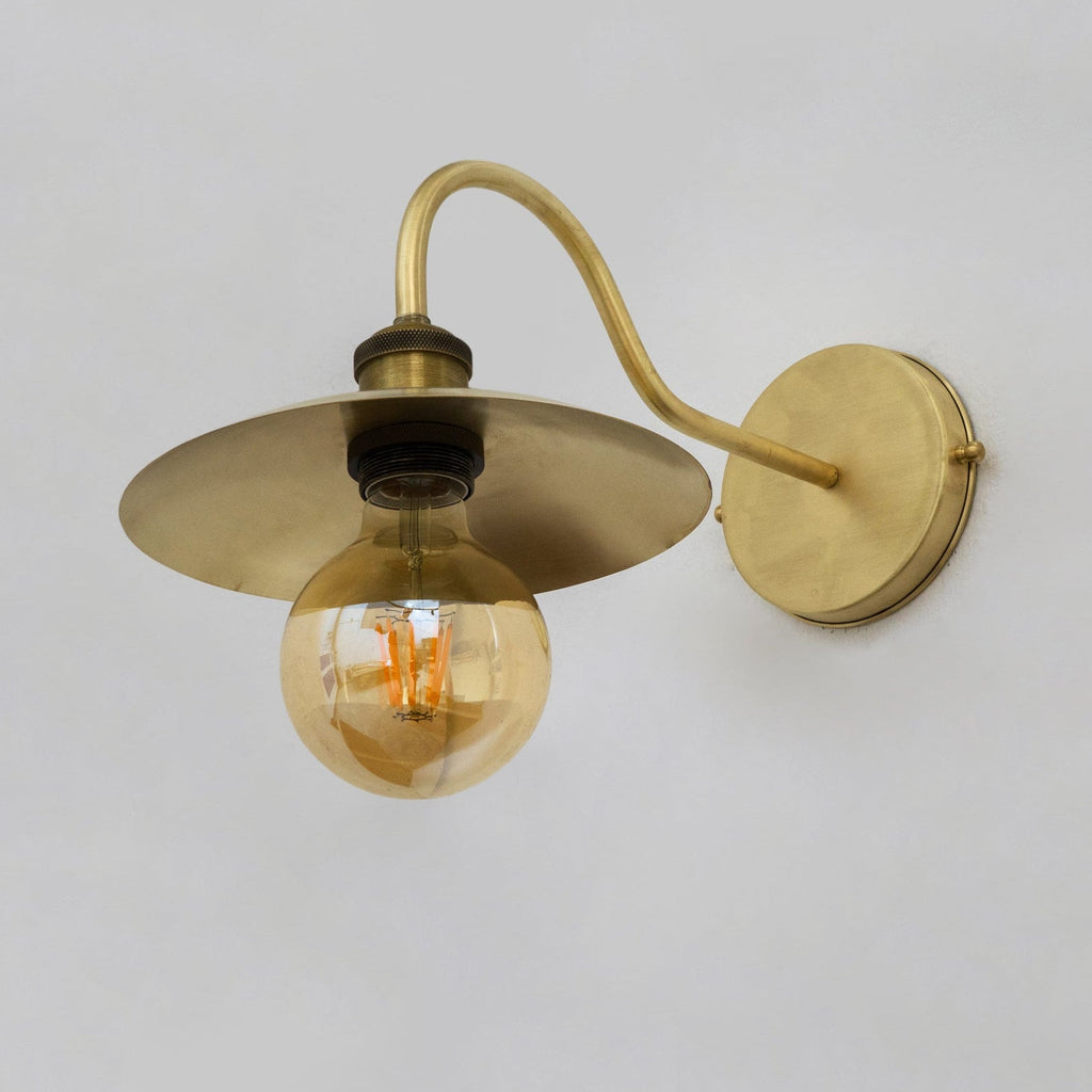 Underside of the brass wall sconce showing the socket