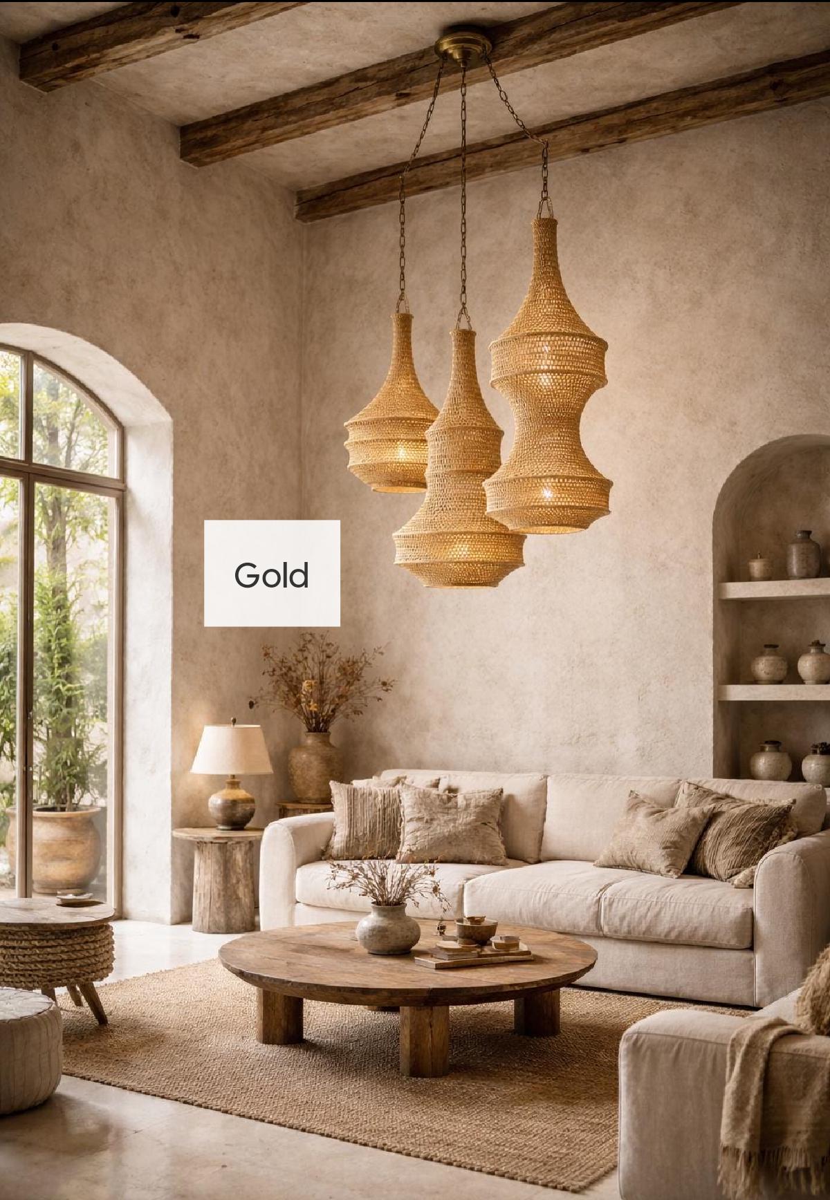 A trio of woven pendant lights with a natural tan finish suspended from the ceiling by chains. The lights feature a…