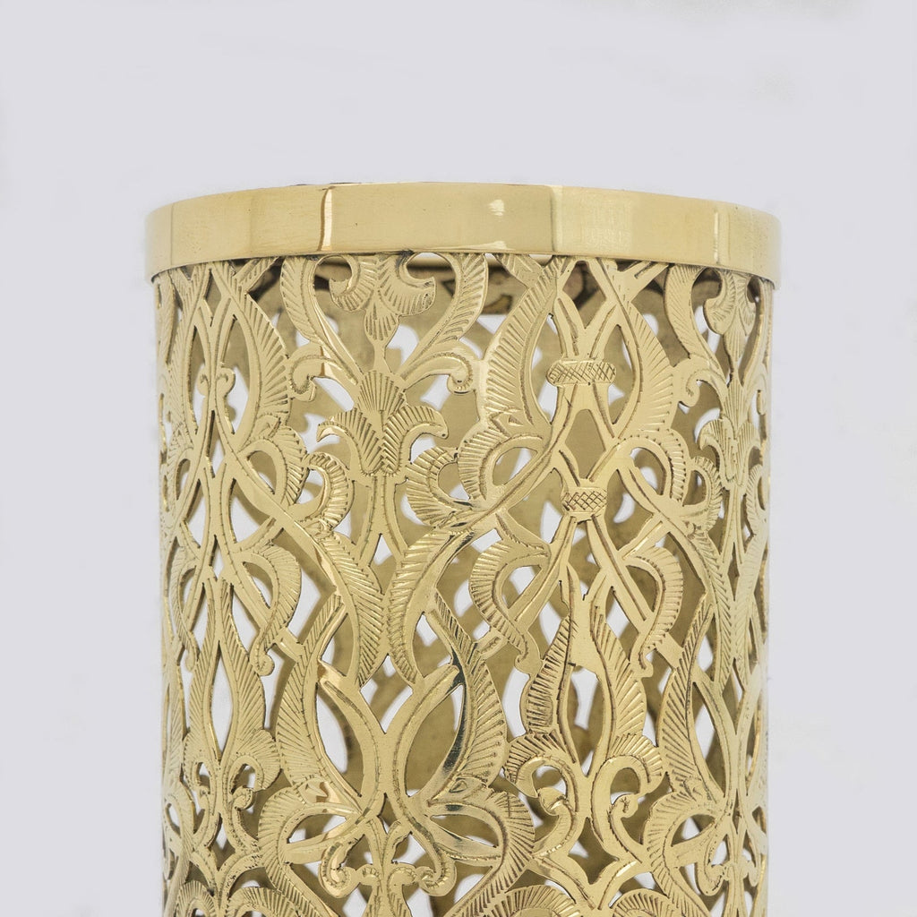 Close-up of the hand-finished pierced brass pattern and upper rim