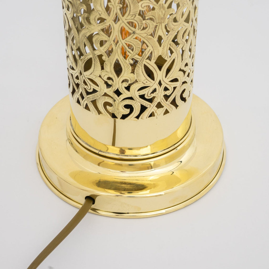 Detail of the polished brass lamp base and cable entry