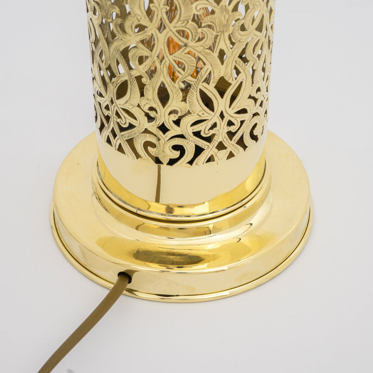 Detail of the polished brass lamp base and cable entry