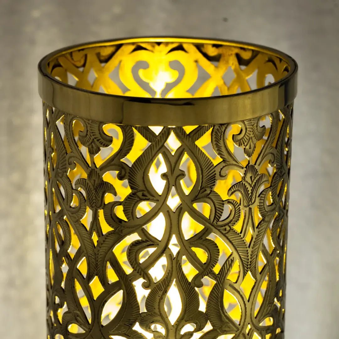 Lit upper section showing the pierced brass pattern